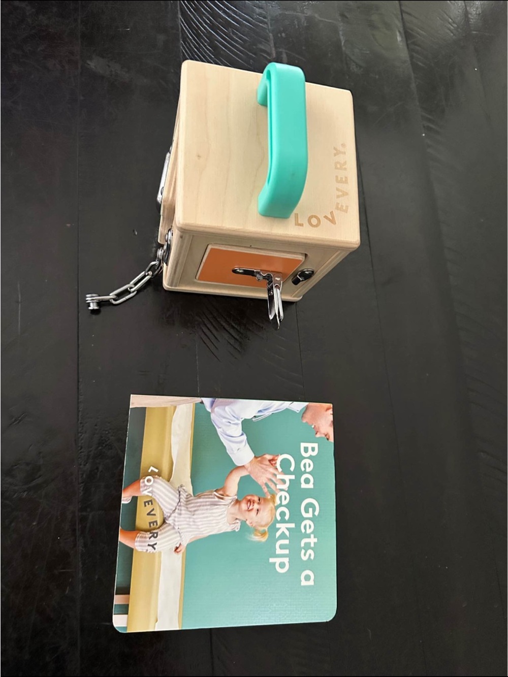 Lovevery Wooden Lock Box with Turquoise Handle and Orange Accent
